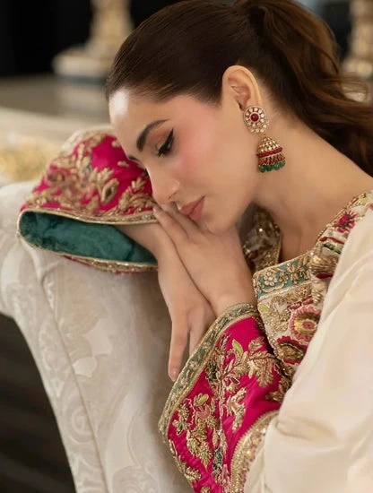 ALEEAN KHAN - KINZA clothing in ivory, pink, red, blue, green tones.